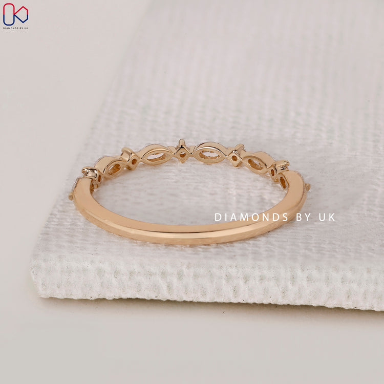 Shared prong marquise and round diamond ring
