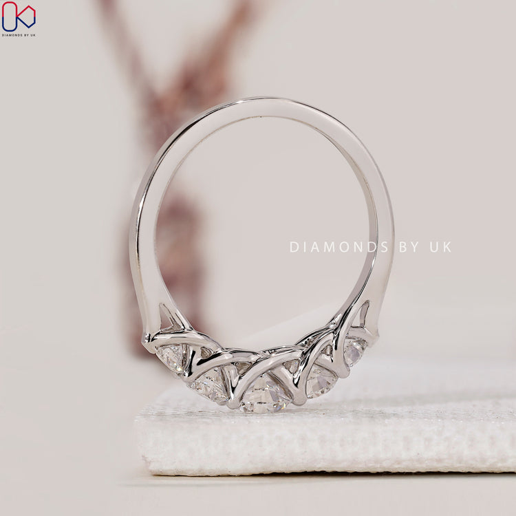 Diamondsbyuk band with trellis design and prong setting.
