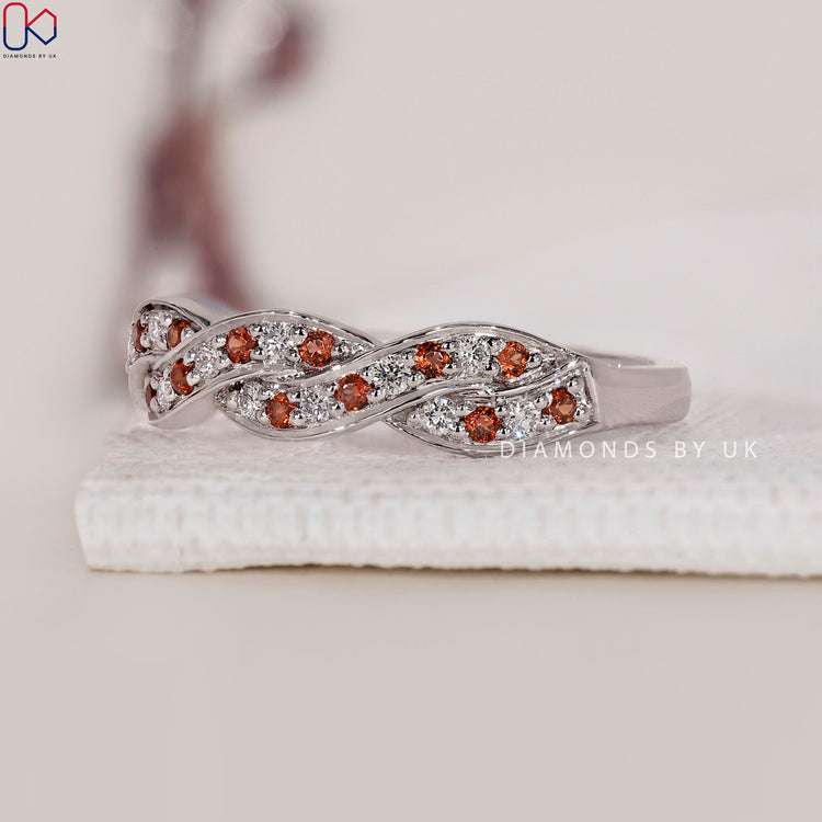 IGI certified twisted wedding band with diamonds for guaranteed quality.
