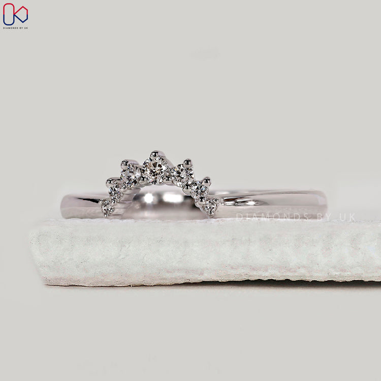 U shaped wedding band with diamonds.
