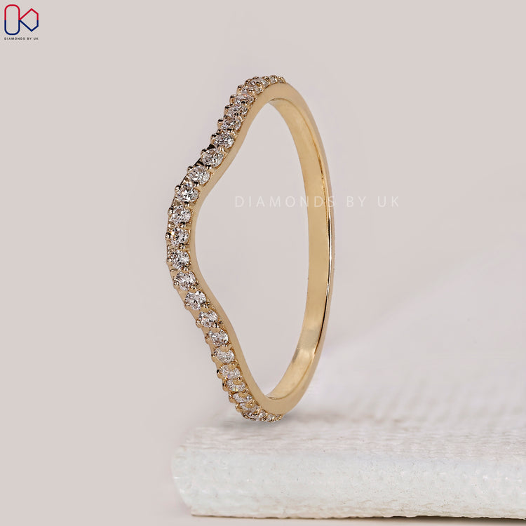 Stackable wedding band with round diamonds.
