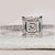 Asscher diamond engagement ring in white gold.
