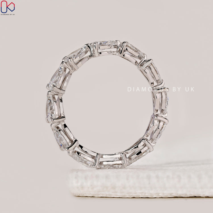 DiamondsbyUK wedding band with claw setting.
