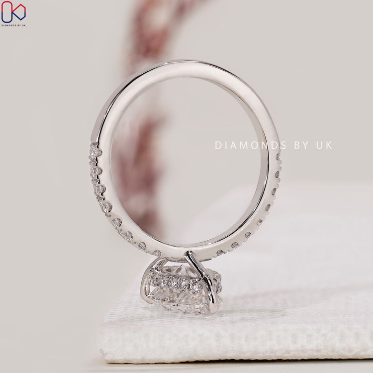 Lab-grown diamond engagement ring with a pave setting.
