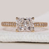 Radiant cut diamond engagement ring in yellow gold.
