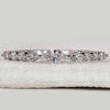 Round and marquise diamond band in white gold.
