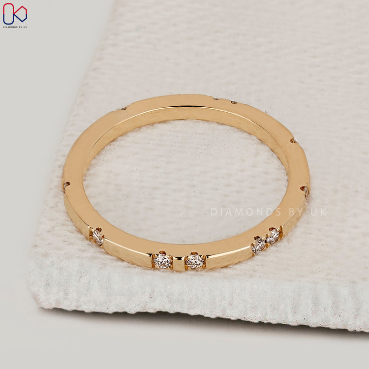 Custom handmade wedding band in yellow gold with diamonds.
