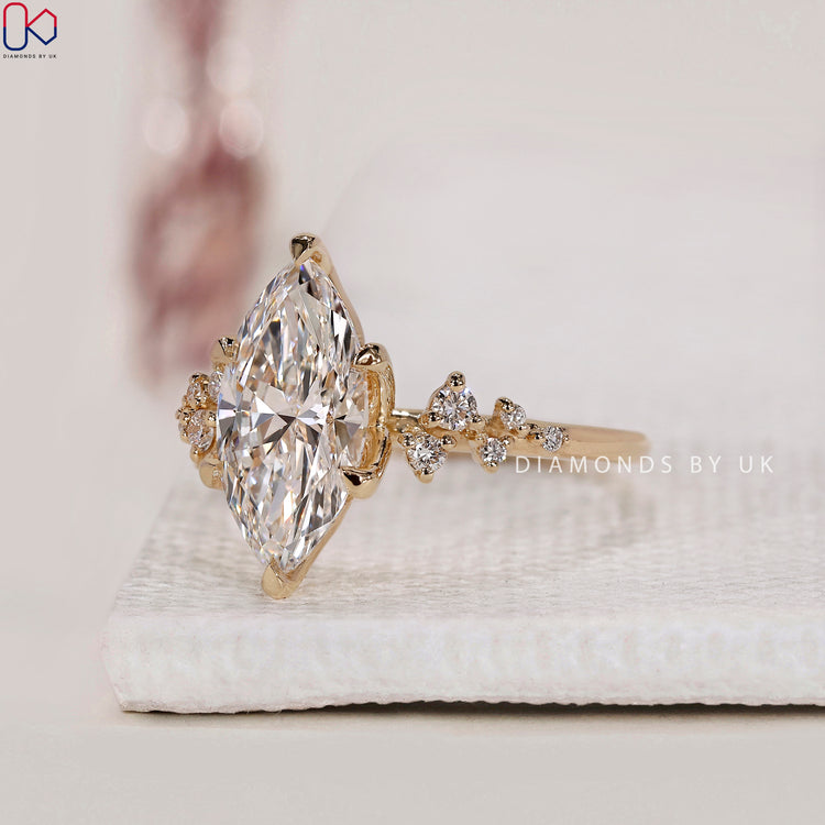 Cluster setting marquise diamond engagement ring.
