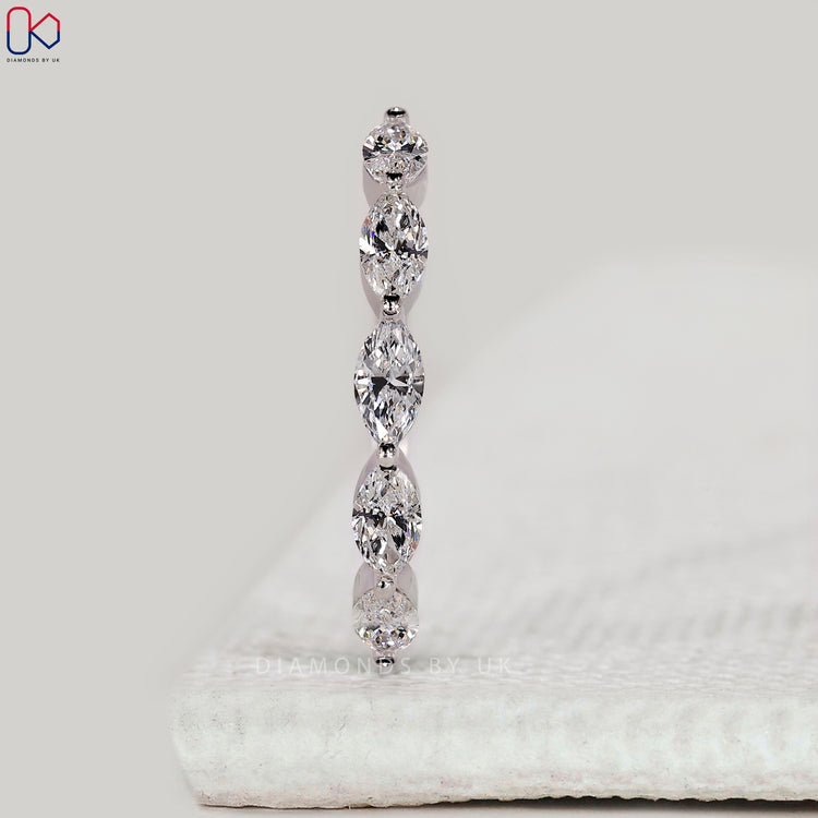 White gold wedding band with marquise diamonds.
