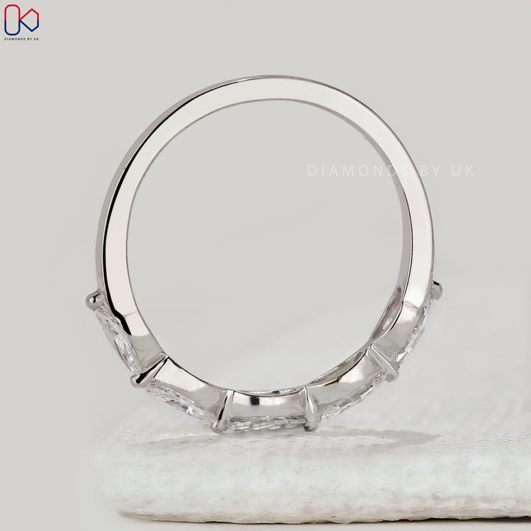 Handmade band with marquise diamonds.
