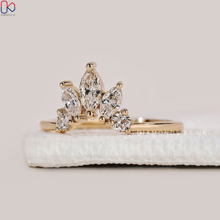 Yellow gold wedding band with crown wedding band.
