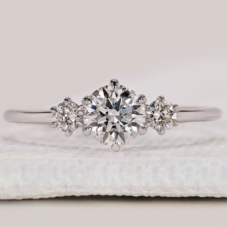 Three stone round diamond ring in white gold.
