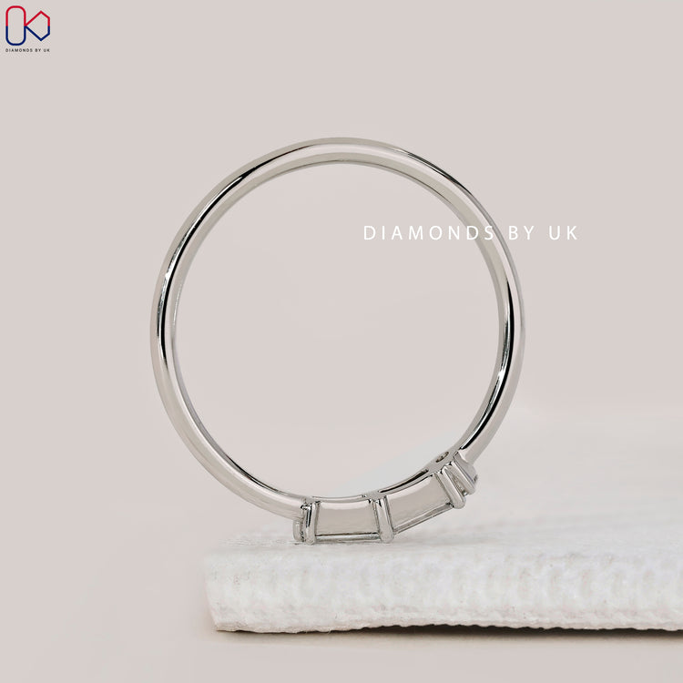 Minimalist handmade white gold diamond wedding band.
