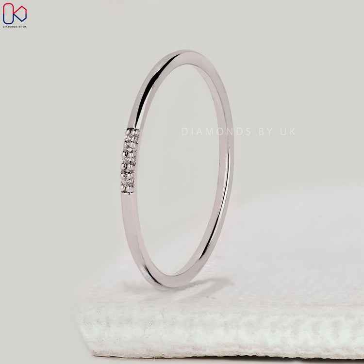 White gold wedding band with minimalist design.
