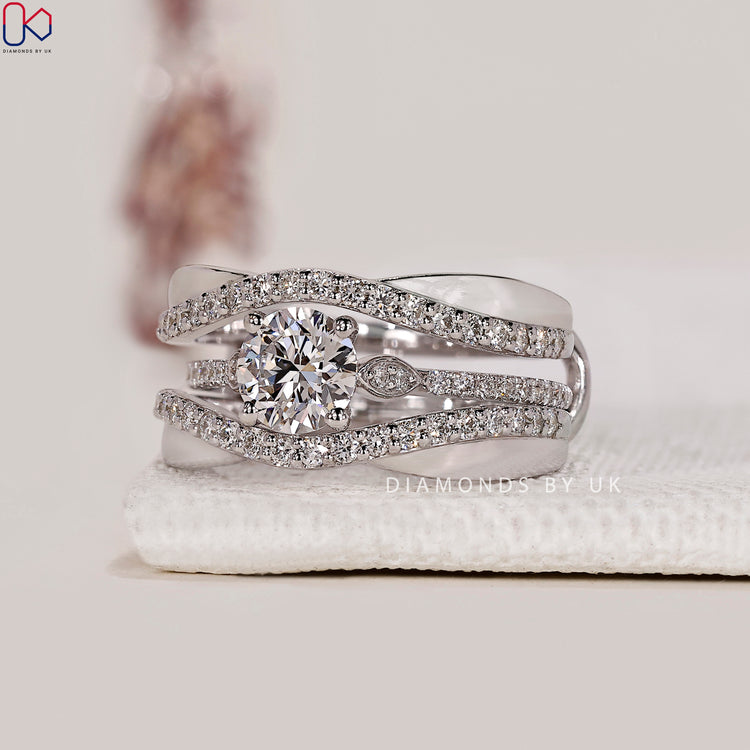 Round side stone ring with precise diamond placement.
