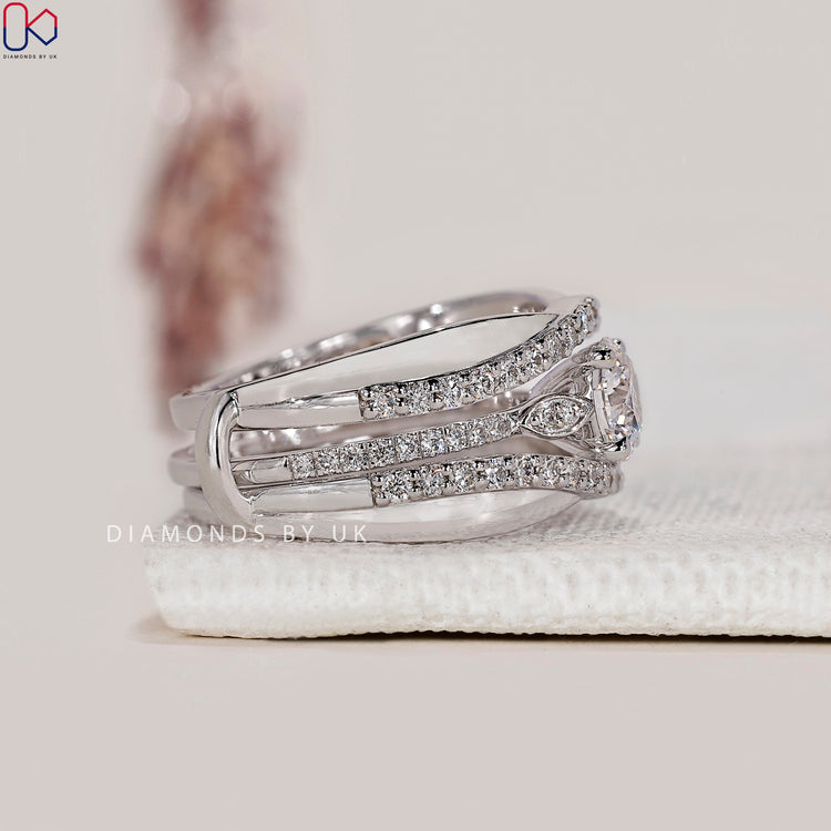 Ring enhancer wedding band designed to fit around an engagement ring.
