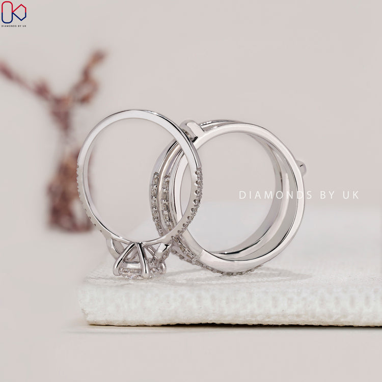 Wrap guard wedding band securing the engagement ring in place.
