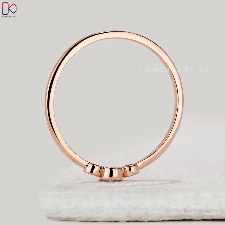Custom handmade bezel set diamond band in rose gold.
