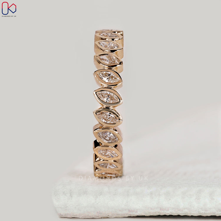 Handmade bezel set diamond band by Diamondsbyuk.
