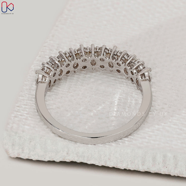 Custom handmade shared prong wedding band in white gold.
