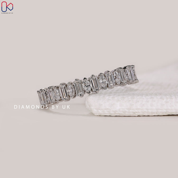 V shaped prong wedding band by Diamondsbyuk.
