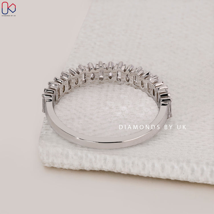 White gold V shaped prong diamond band.
