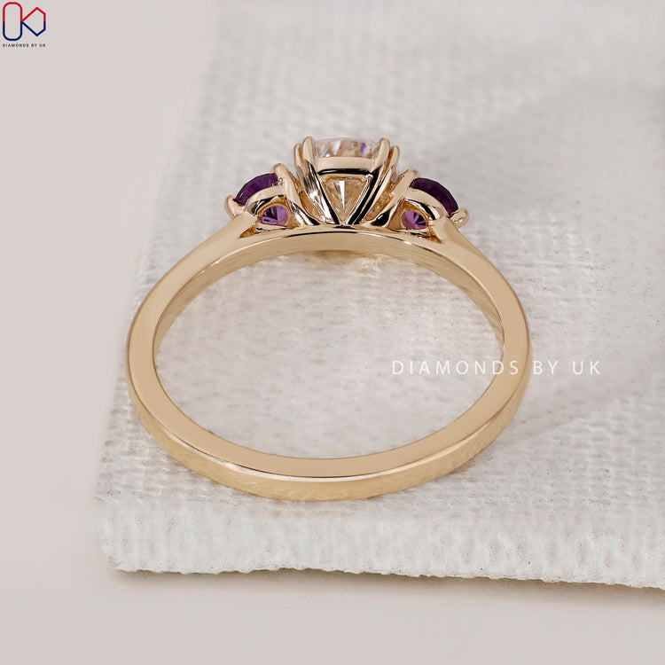 Tapered shank yellow gold diamond engagement ring.
