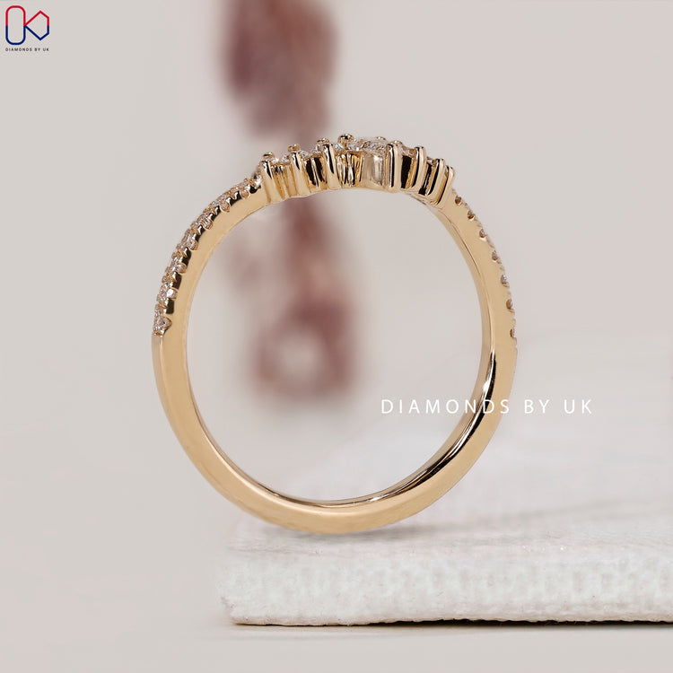 Yellow gold half eternity band with diamonds.
