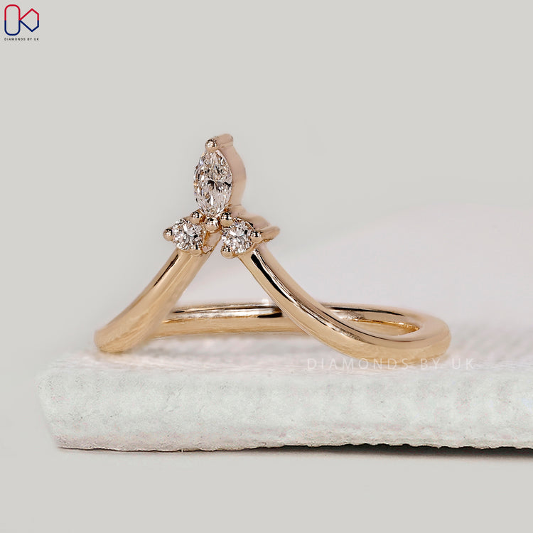 3 stone wedding band with marquise and round diamonds.
