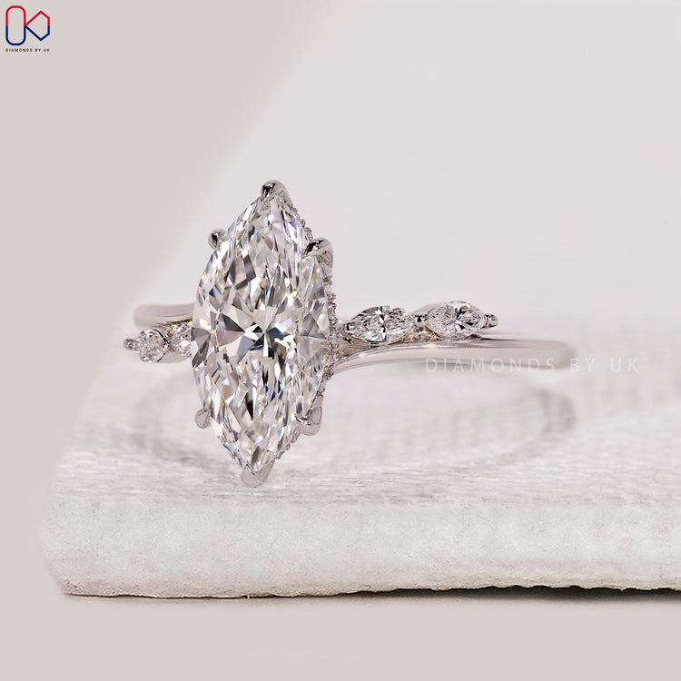 Marquise side stone diamond engagement ring.
