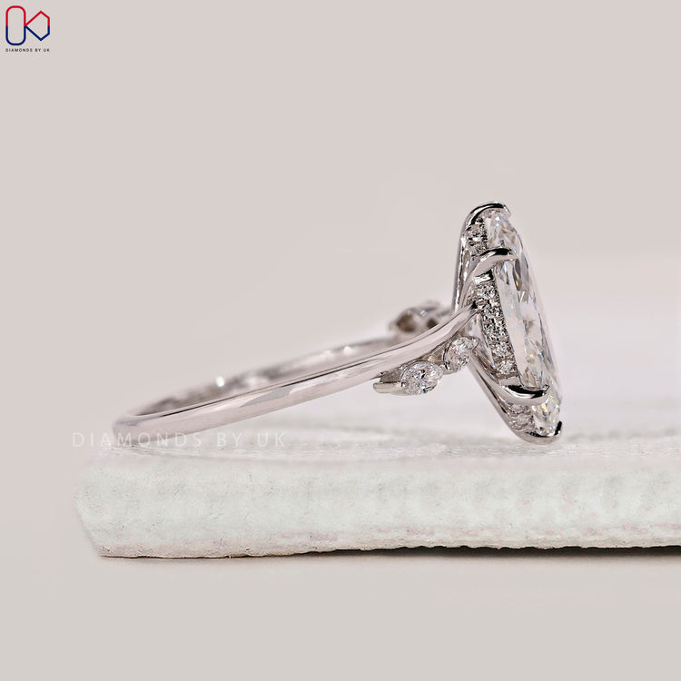 White gold engagement ring with marquise cut diamonds.
