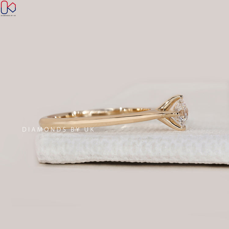 Four prong setting round cut engagement ring.
