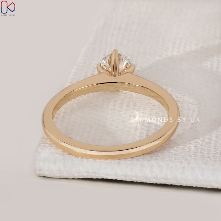 Handmade yellow gold solitaire engagement ring.
