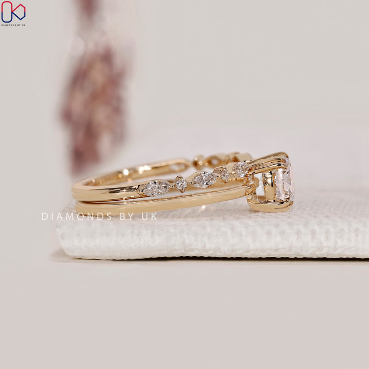 Open gap wedding band designed to fit an engagement ring.
