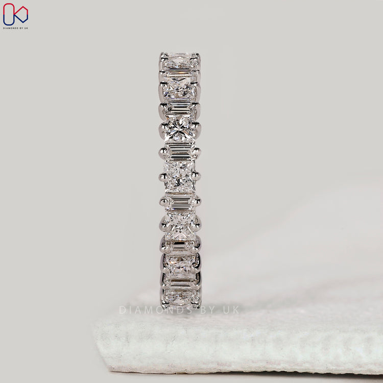 Prong setting wedding band with princess and baguette stones.
