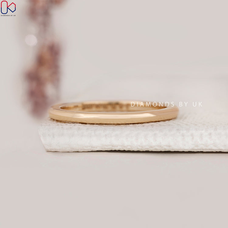 Diamondsbyuk wedding band in yellow gold finish.
