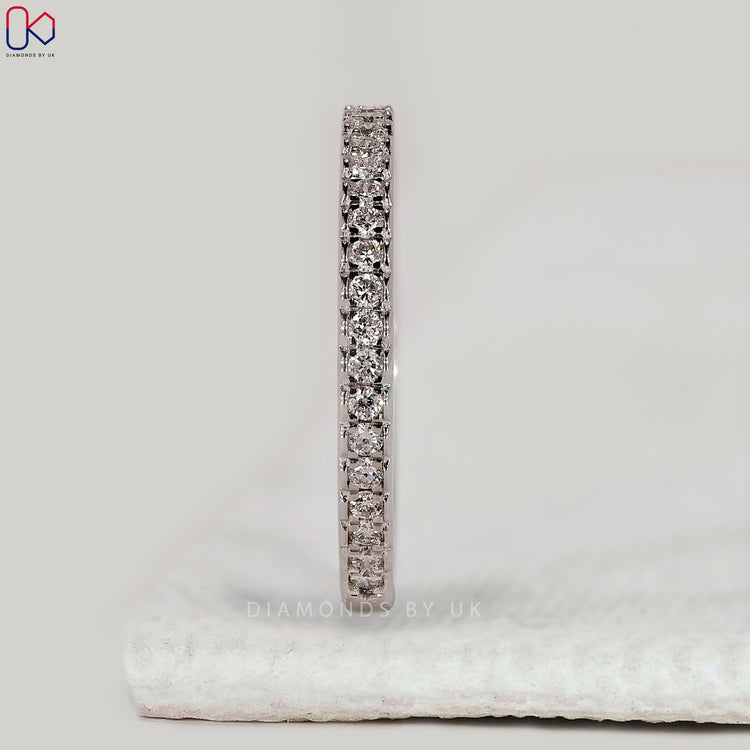 Buy wedding band with round diamonds.
