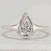 Pear cut solitaire ring with three prong bezel setting.
