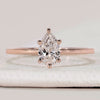 Pear cut solitaire ring with tapered shank design.