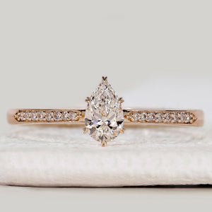 Pear Cut Engagement Ring With Tapered Pave Style