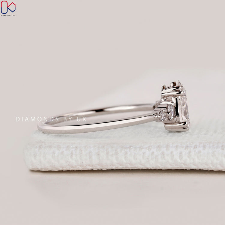 Handmade pear cut ring with round side diamonds.