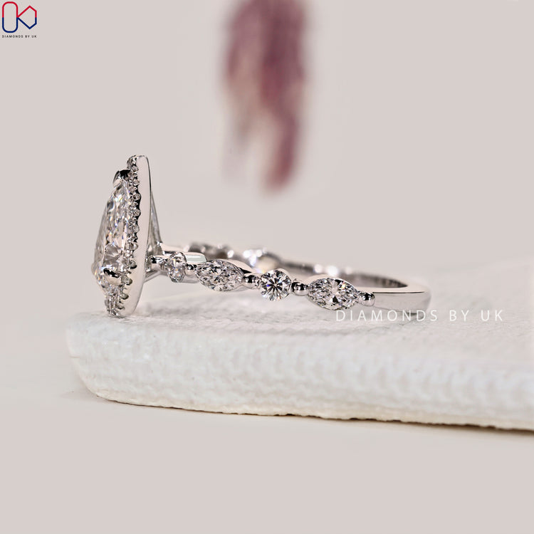 Claw prong setting ring with white gold finish.
