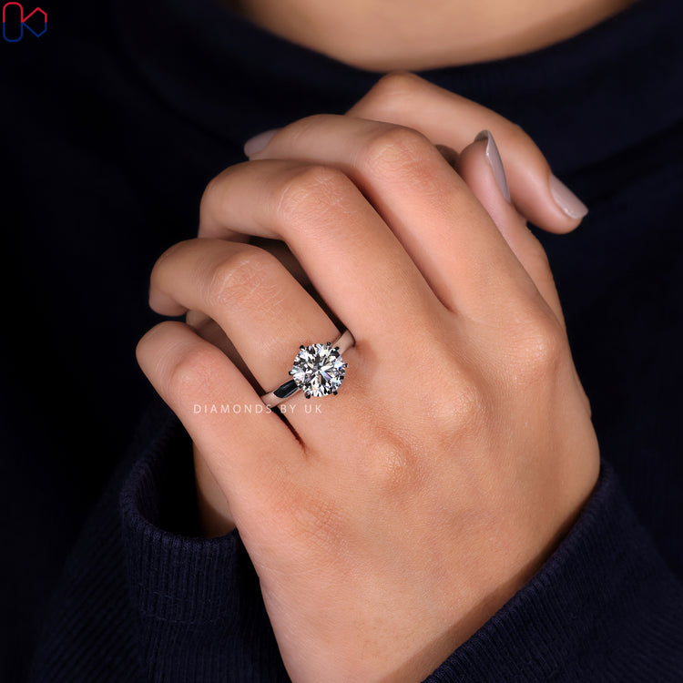 Round diamond engagement ring set in a solitaire setting with a white gold band.