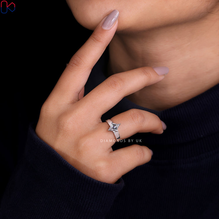 4 prong claw setting with an antique cut diamond for added brilliance.
