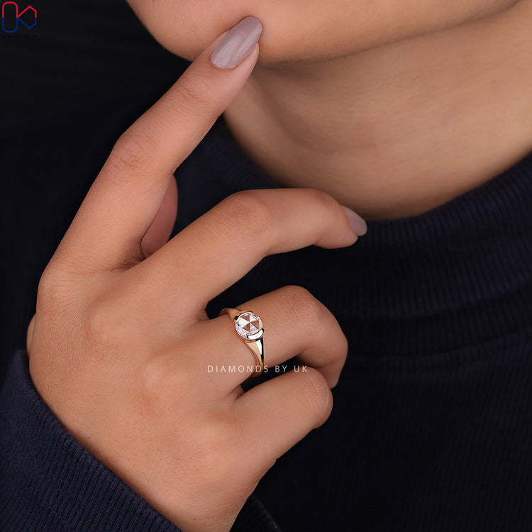 Simple engagement ring featuring a round rose cut diamond.