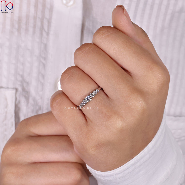 Classic round diamond wedding band featuring exceptional brilliance.
