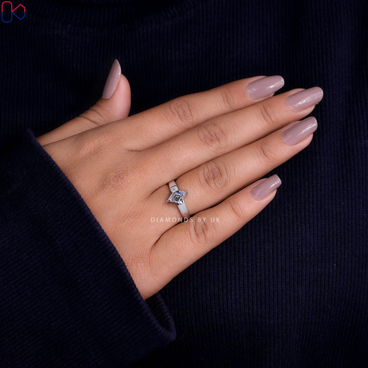 Handmade ring with an antique cut diamond set in a white gold band.
