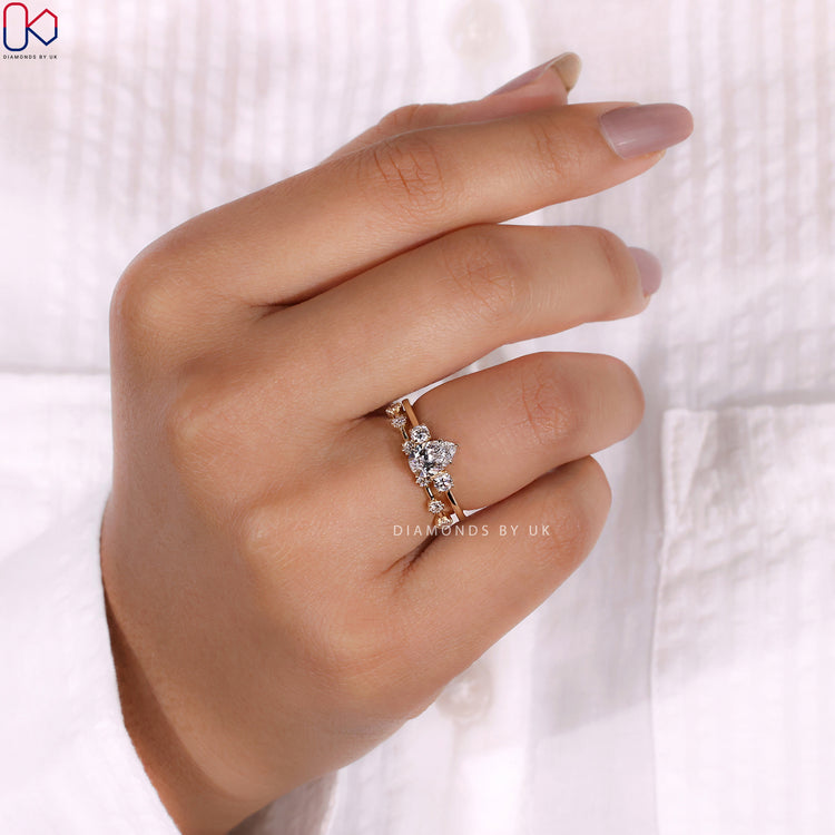 Elegant pear and round cut diamond set in yellow gold bridal set.
