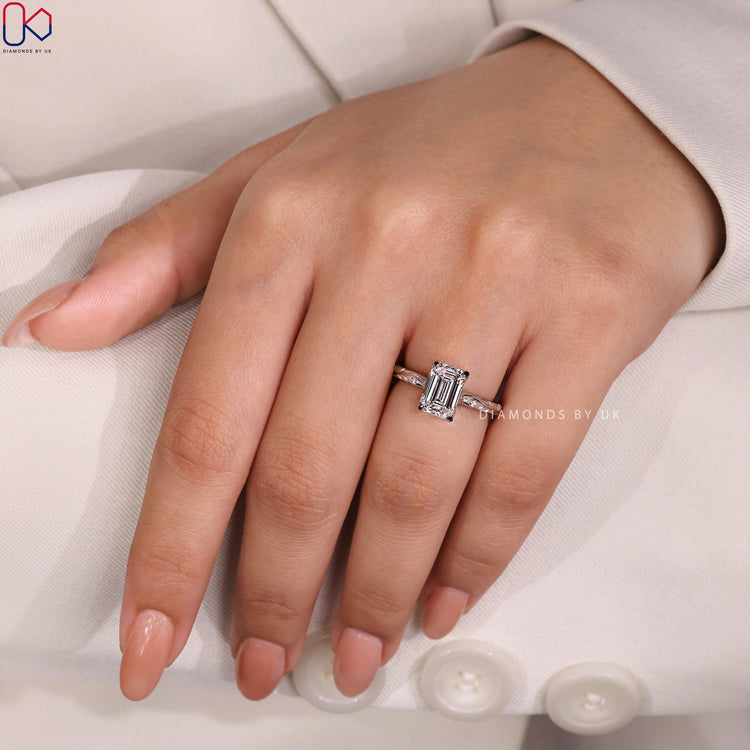 Lab Grown Diamond Ring with Emerald Cut and side diamonds in an Art Deco design, IGI certified.
