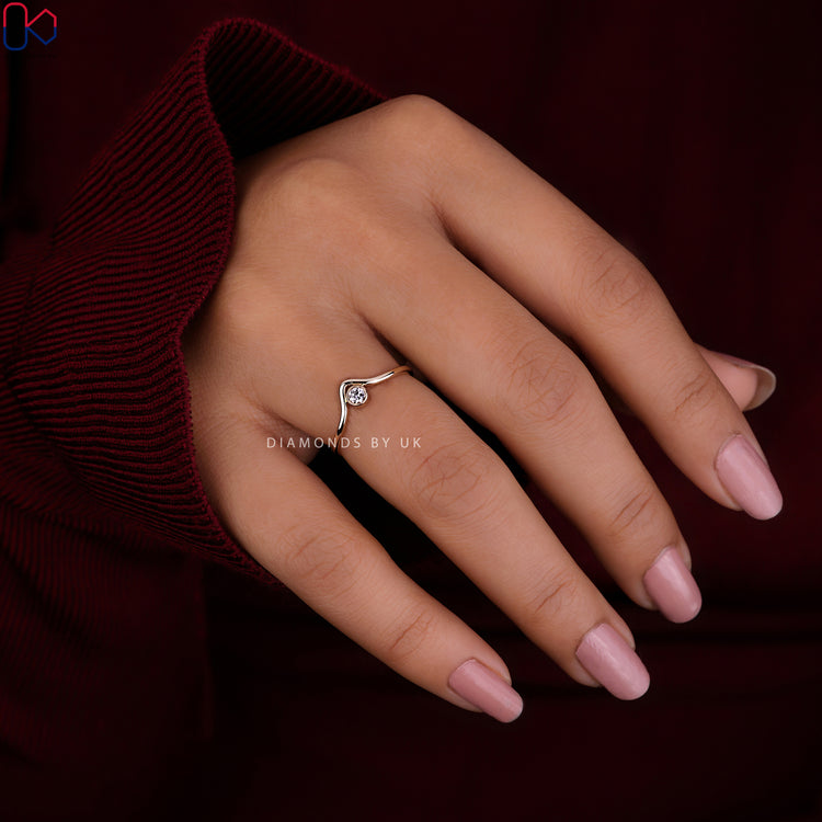 Bezel set wedding band showcasing sleek and secure diamond settings for everyday wear.
